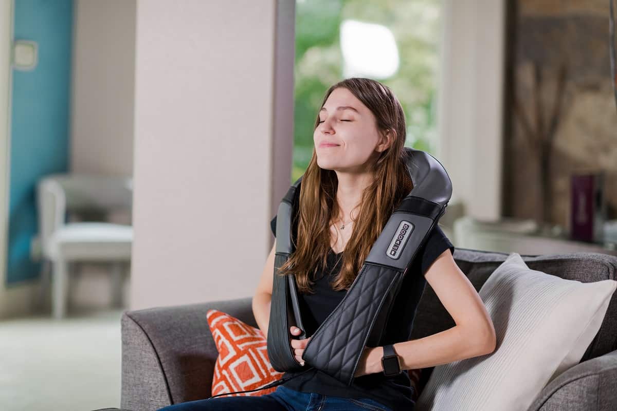 woman using ireliev neck and back massager